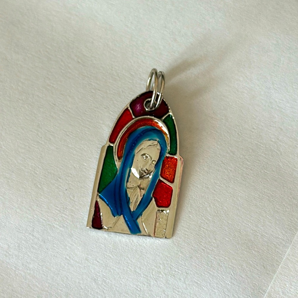 Sterling silver mother Mary charm.
